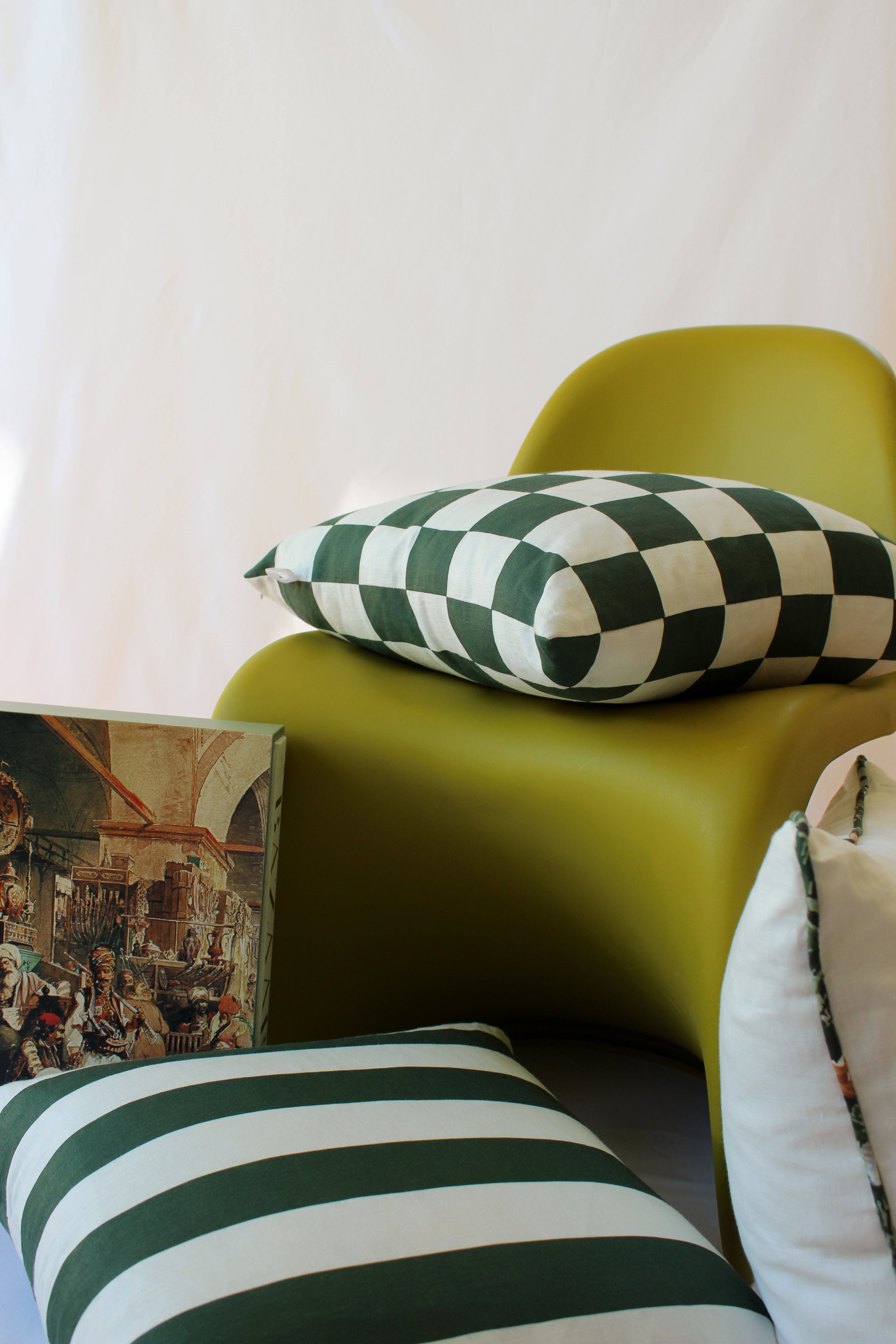 Checkered and Striped Green Cushions Styled on Living Edge Chair