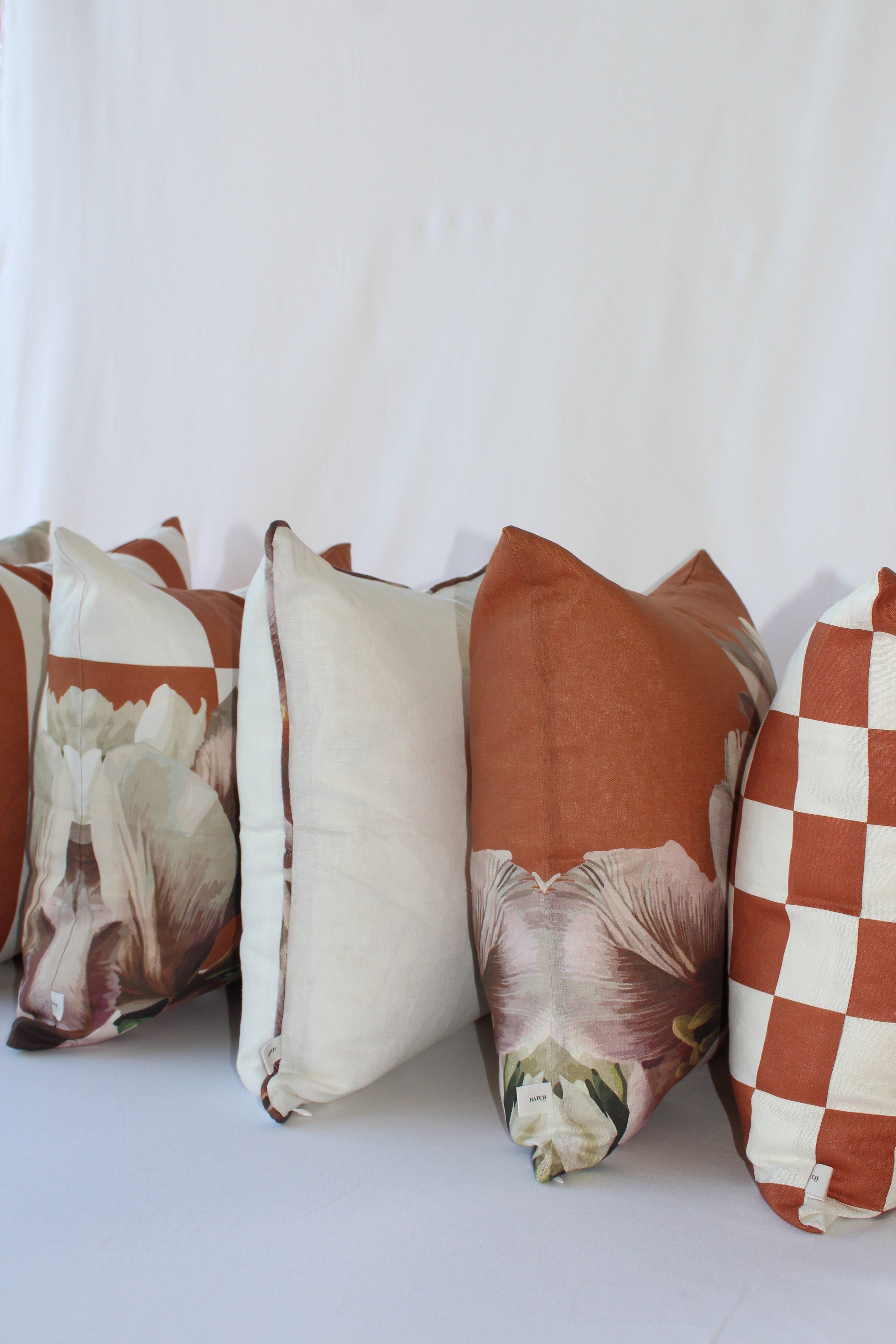 Cinnamon Piping | White Cushion with Burnt Orange Floral Piping