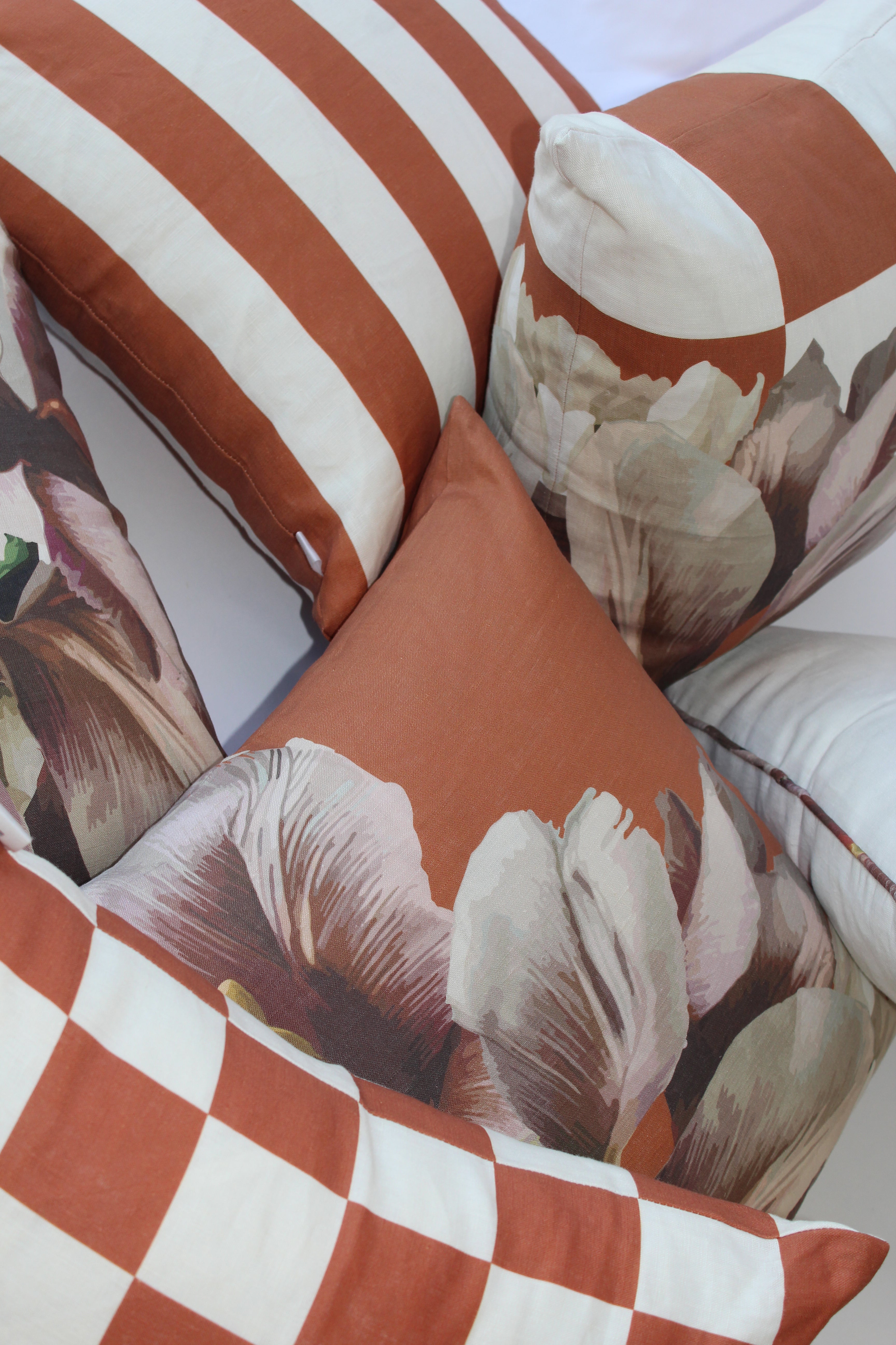 Striped Cushion features elegant contrasting white and cinnamon stripes