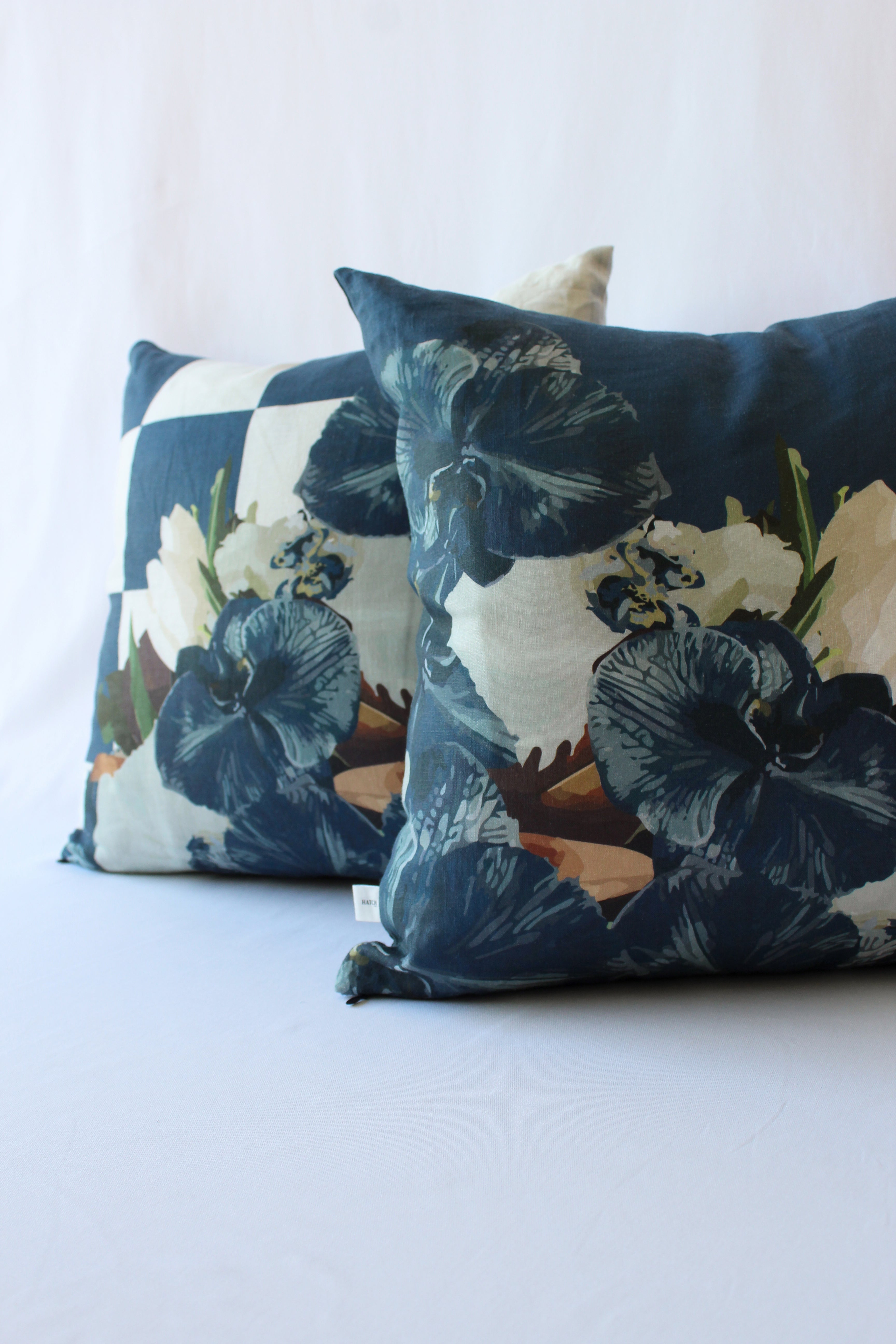 Navy slate checkered and floral cushions in a premium linen