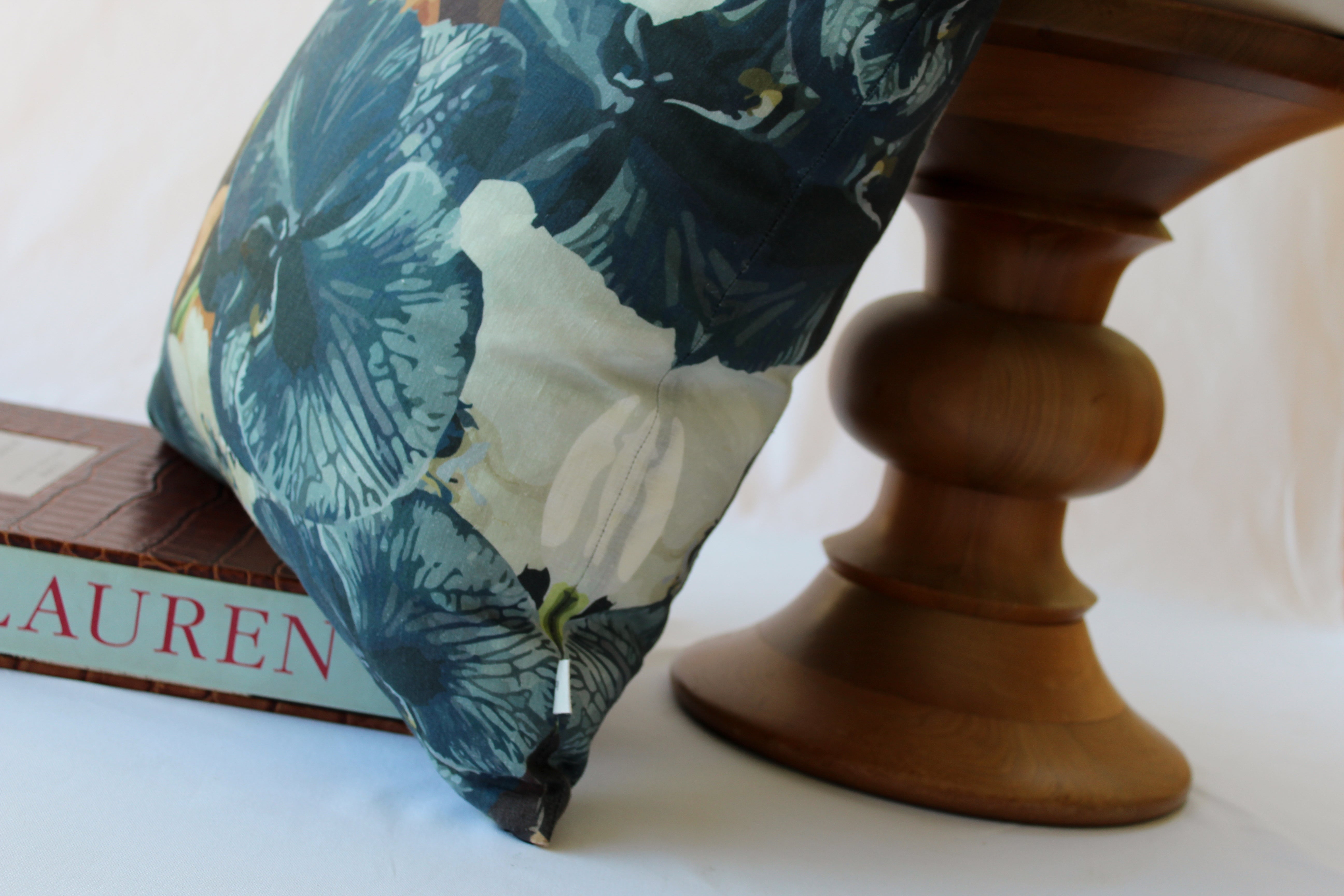 Navy slate floral linen cushion styled with luxury decor pieces