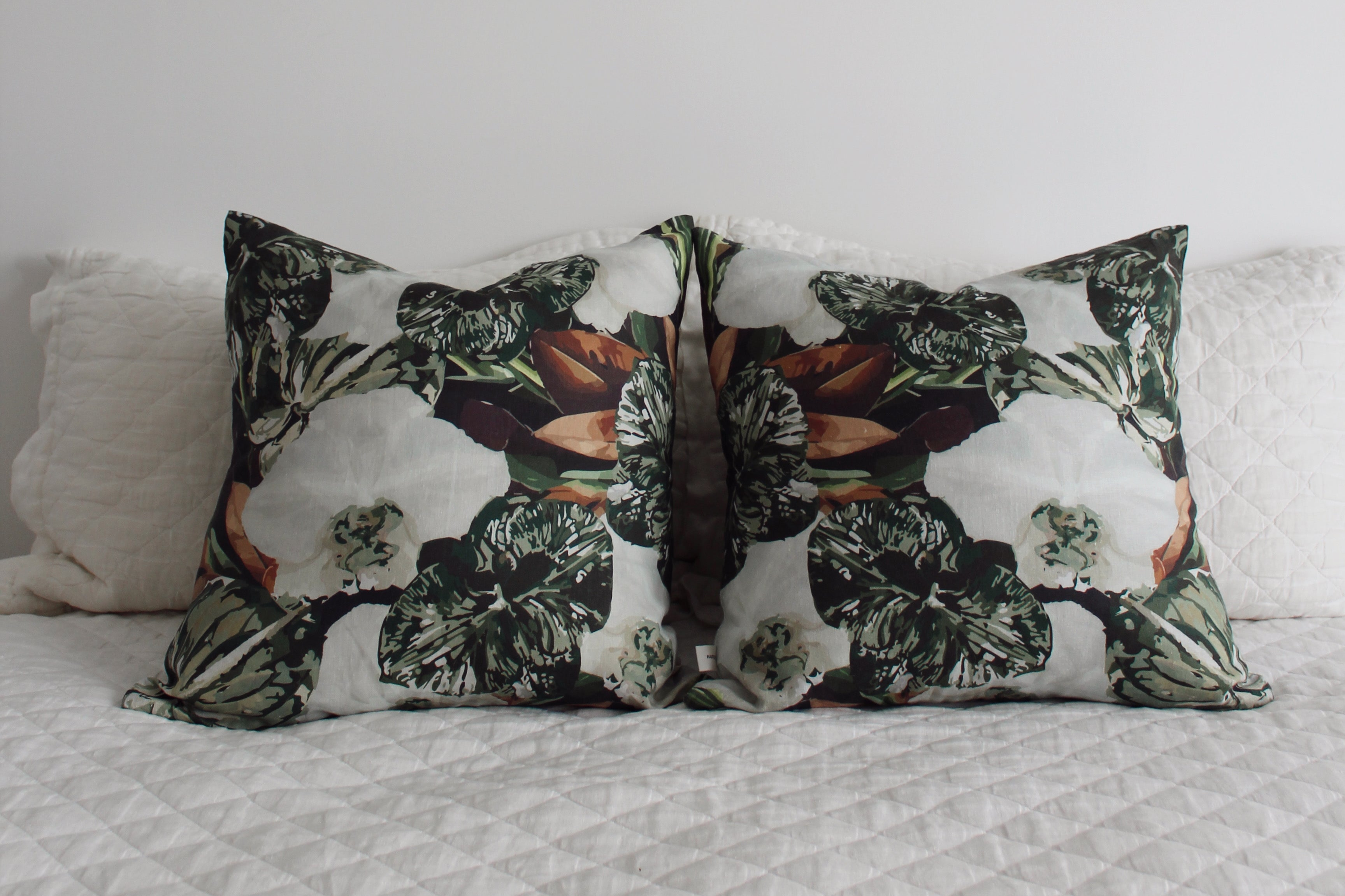 Handmade pistachio green linen cushion with floral pattern